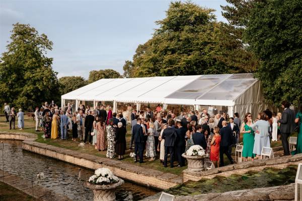 Wedding reception in a frame marquee with partially transparent roof