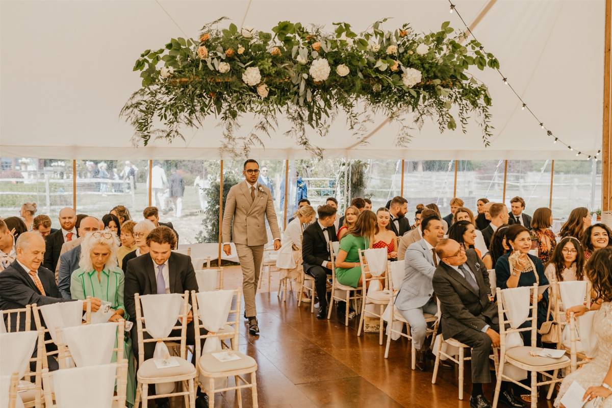 Wedding ceremony in a marquee - photo by Shelby Ellis