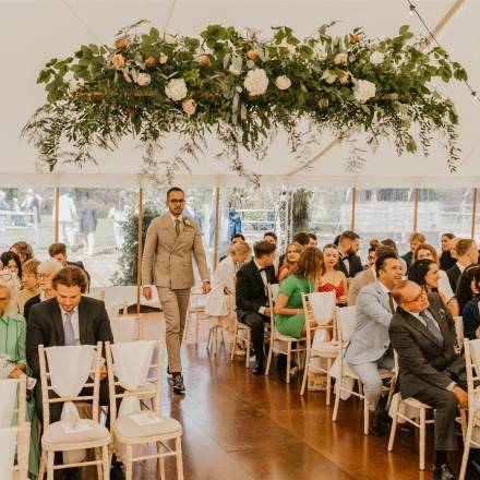 Wedding ceremony in a marquee - photo by Shelby Ellis