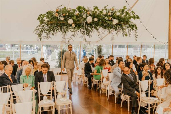 Wedding ceremony in a marquee - photo by Shelby Ellis