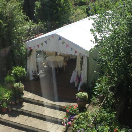 Frame marquee in narrow London garden