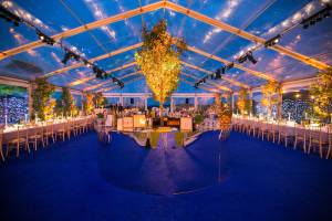 Glamorous completely transparent marquee lit up at night
