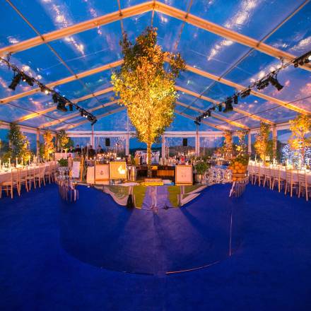 Glamorous completely transparent marquee lit up at night