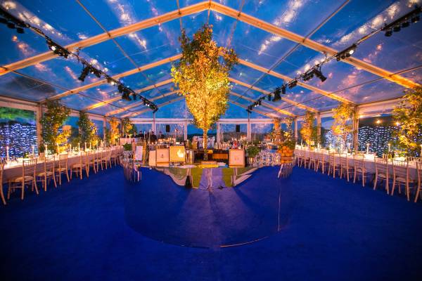 Glamorous completely transparent marquee lit up at night