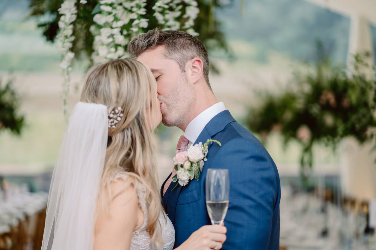 Bride and groom share a kiss