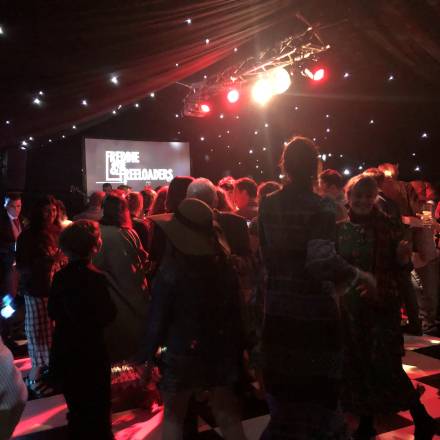 Dancing in a blacked out marquee