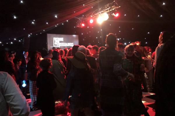 Dancing in a blacked out marquee