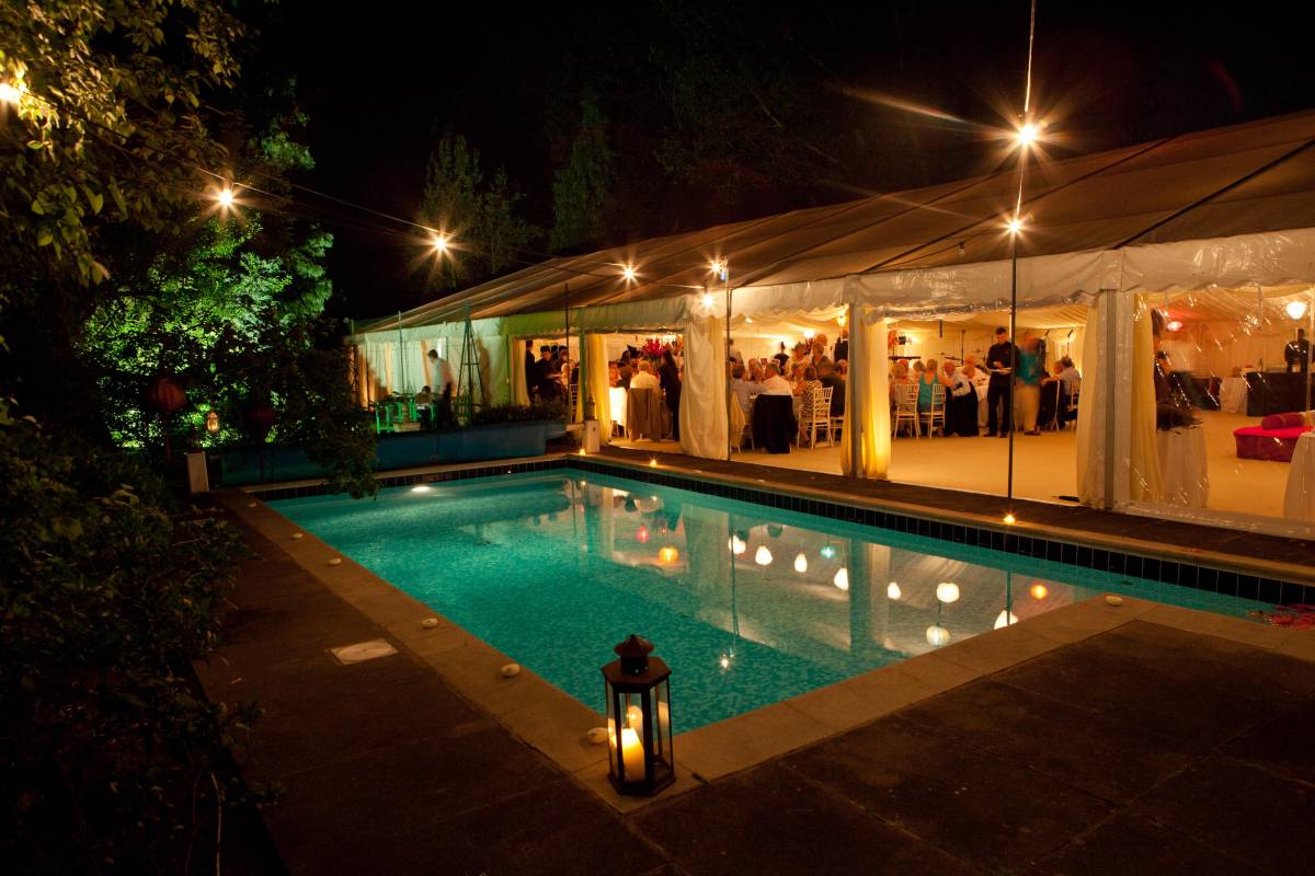 Frame tent alongside a swimming pool