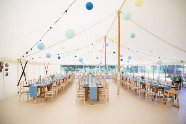 Large simply decorated tent with lanterns