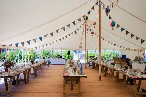 Rustic marquee interior with coconut matting