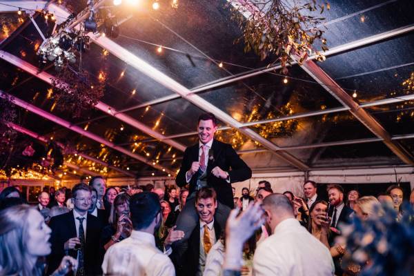 Fun inside a winter marquee while a storm rages outside