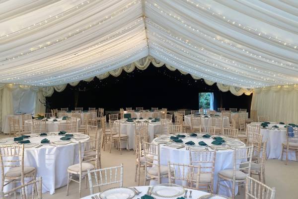 Marquee with fairy lit pleated lining combined with blackout starlit lining over a dance floor