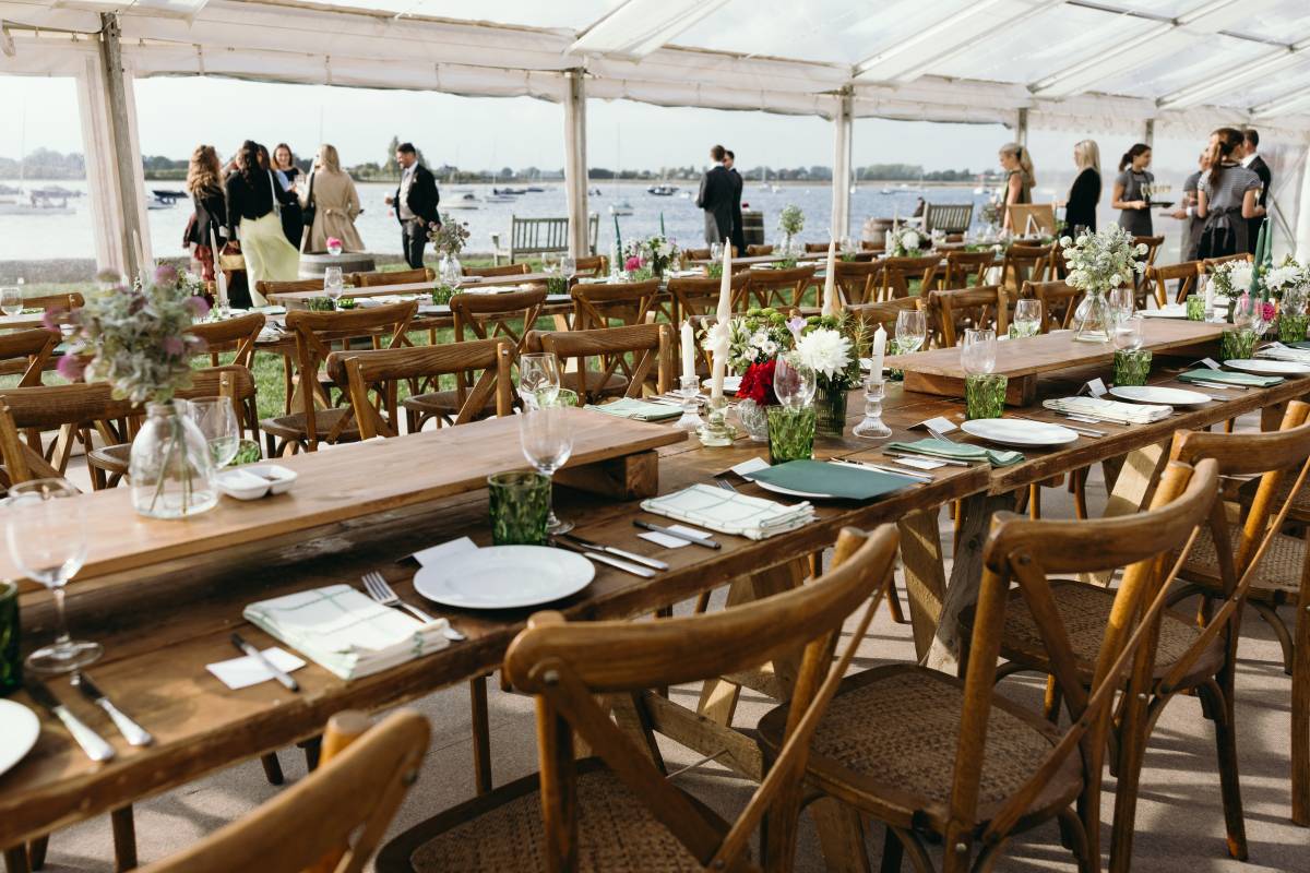 Rustic tables, cross back chairs and views of boats