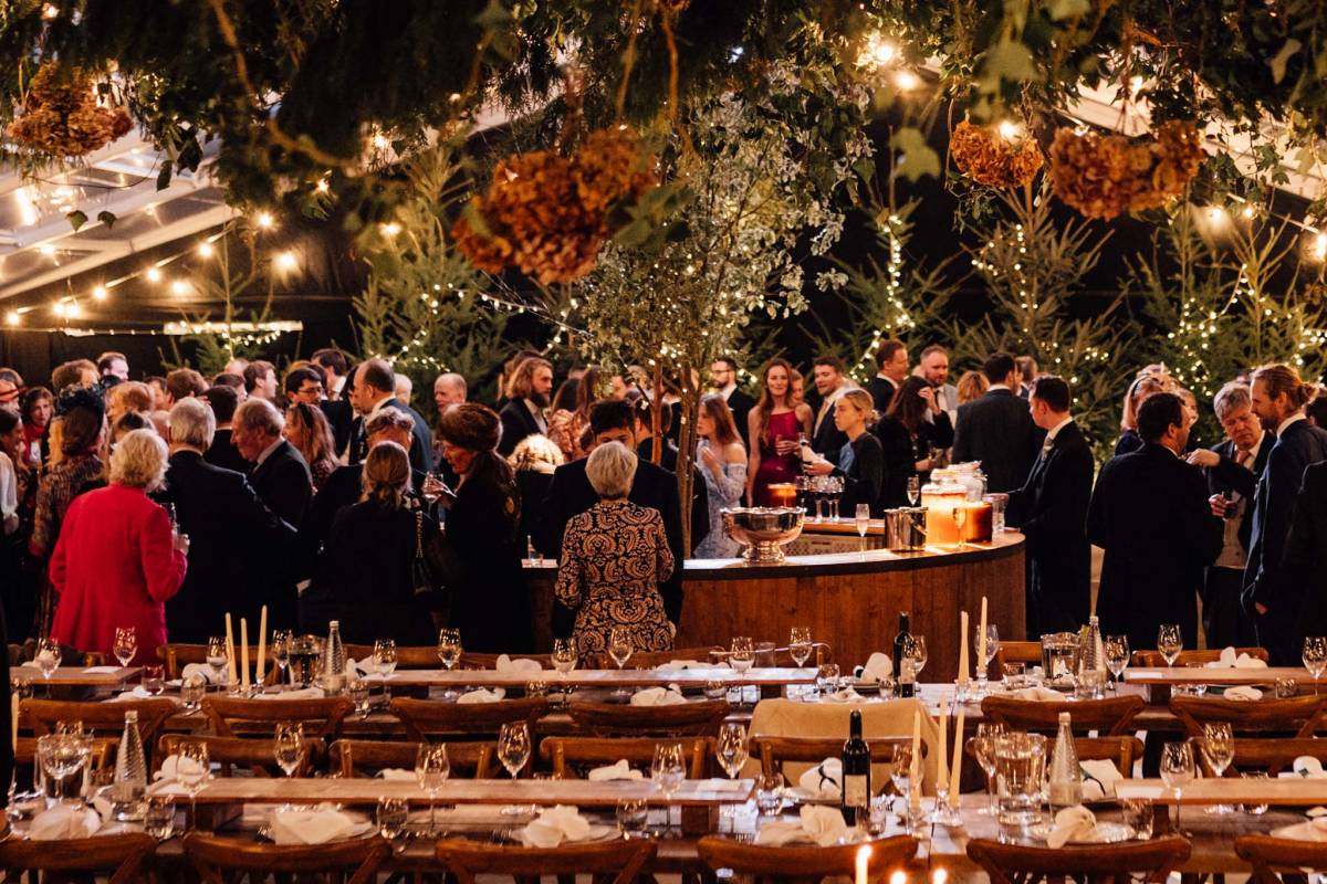 Circular bar surrounded by wedding guests