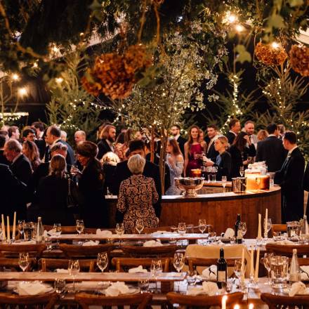 Circular bar surrounded by wedding guests