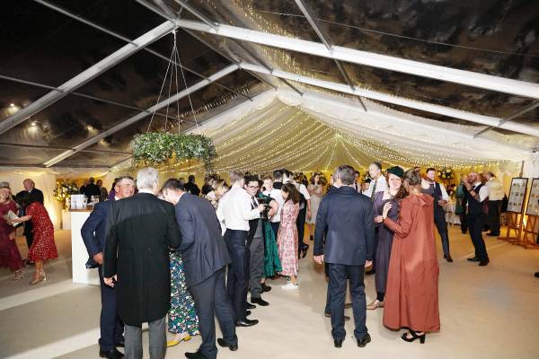 Half clear, half opaque marquee with a fairy light canopy
