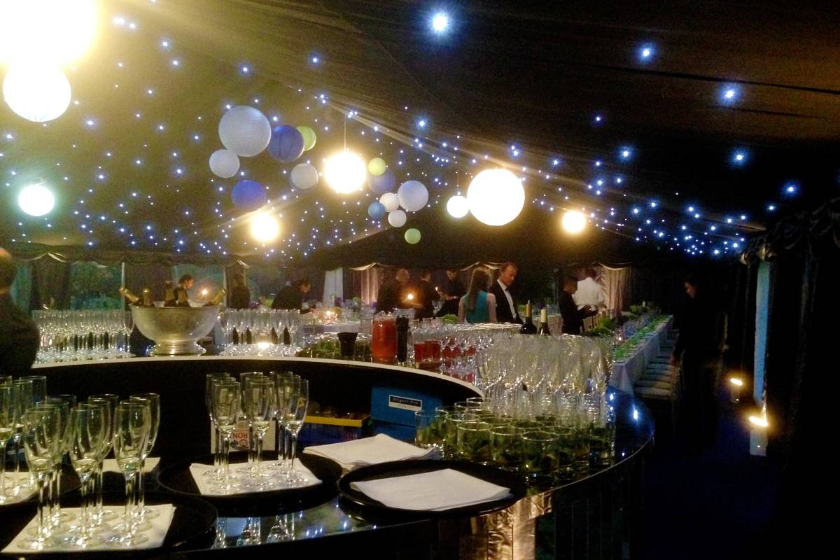 Glamourous reflective circular bar in a sparkly party tent