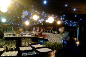 Glamourous reflective circular bar in a sparkly party tent
