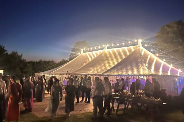 Traditional tent lit with exterior lighting