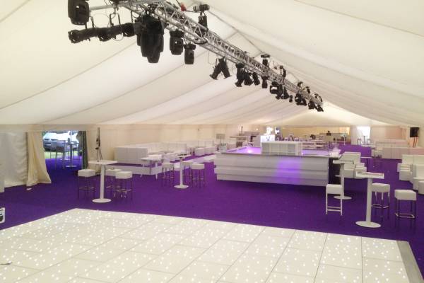 Large marquee with starlight dance floor and purple carpet