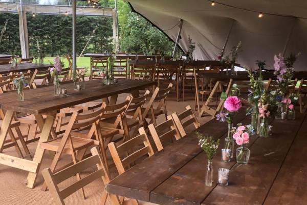 Stretch tent interior with rustic furniture