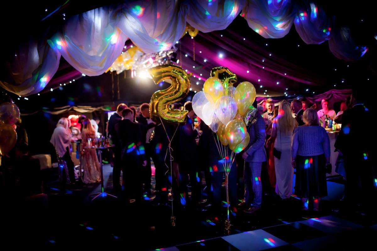 Twenty first birthday party in a blacked out marquee