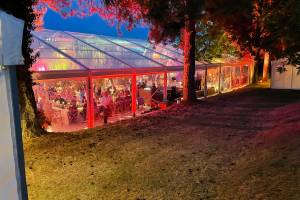 Exterior of brightly lit clear marquee