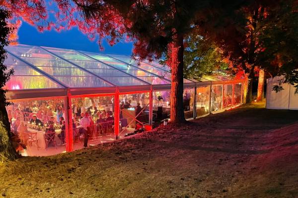 Exterior of brightly lit clear marquee