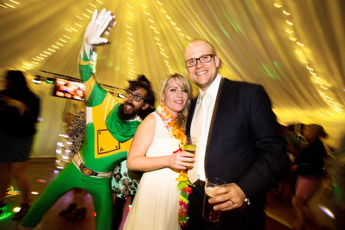 Bridge, groom and a Power Ranger under a fairylight canopy