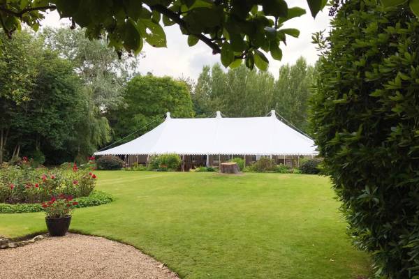 Brigadoon traditional marquee in a large garden