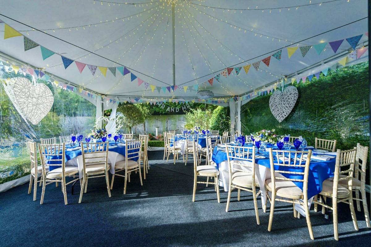 Interior of a small wedding in a Chinese Hat marquee