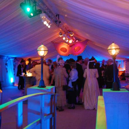 Venice styled reception area with luminous lighting and giant hanging masks
