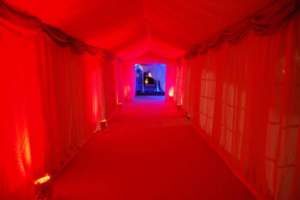 Long red walkway to build suspense for the dramatic themed marquee