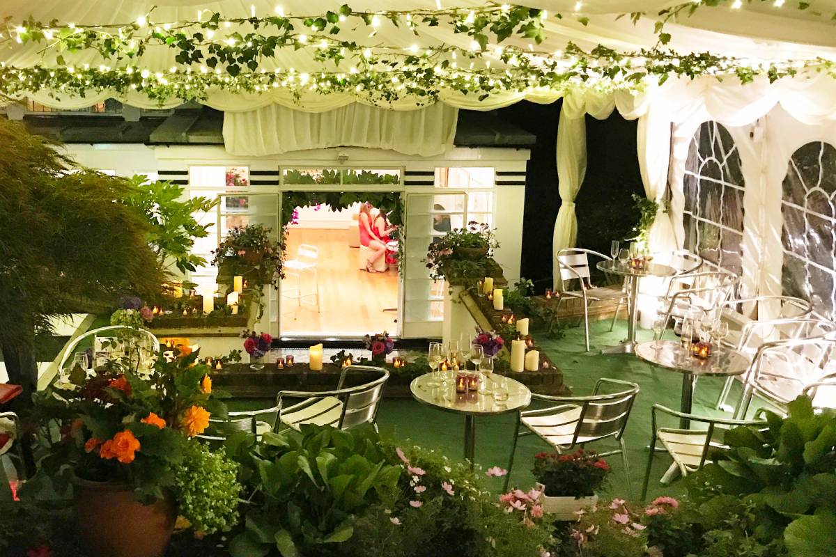 A steeply sloping garden transformed into an glittering flowery party site