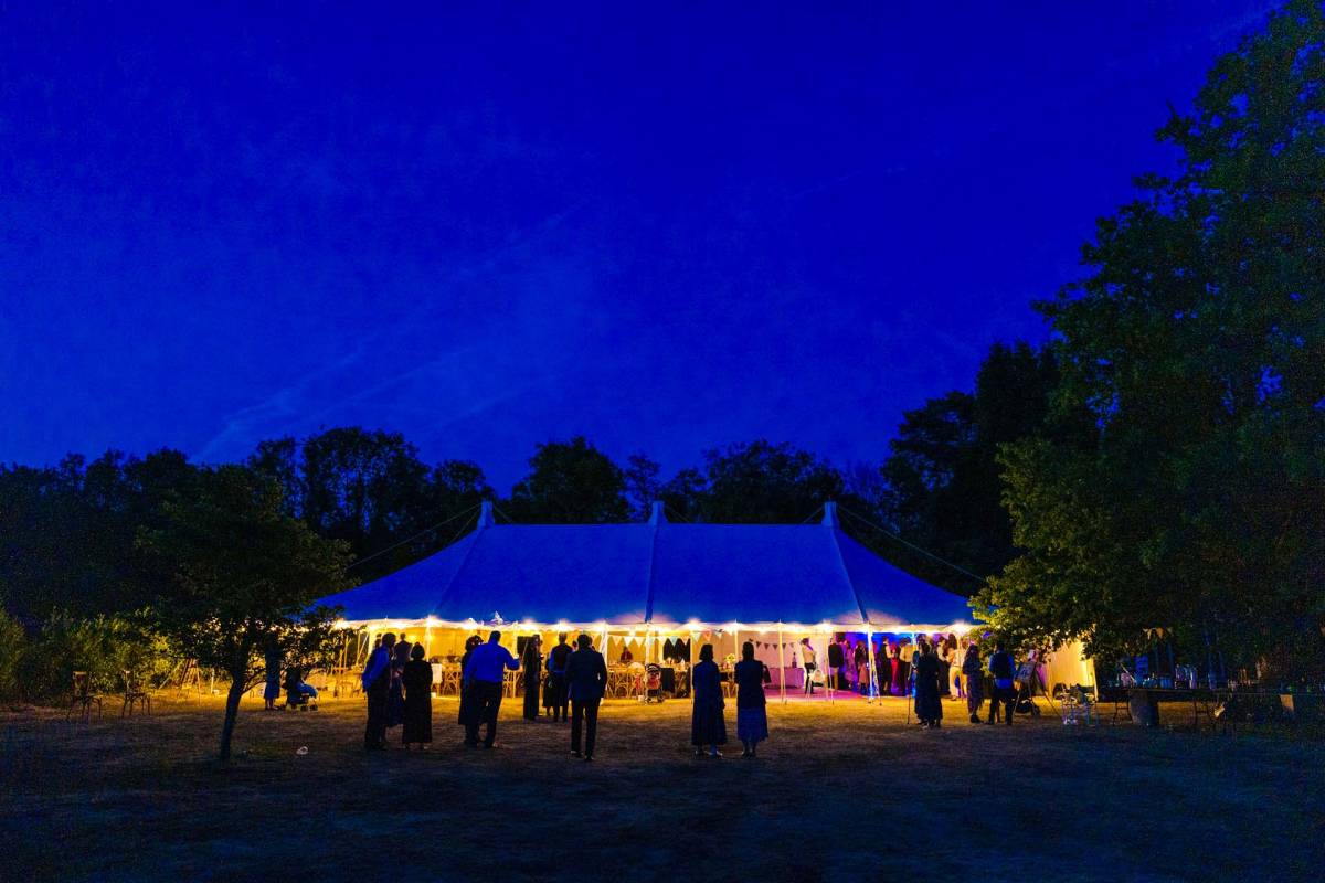 Open sided traditional marquee at night
