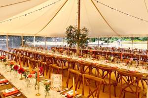 Trestle tables and cross back chairs dressed for a party