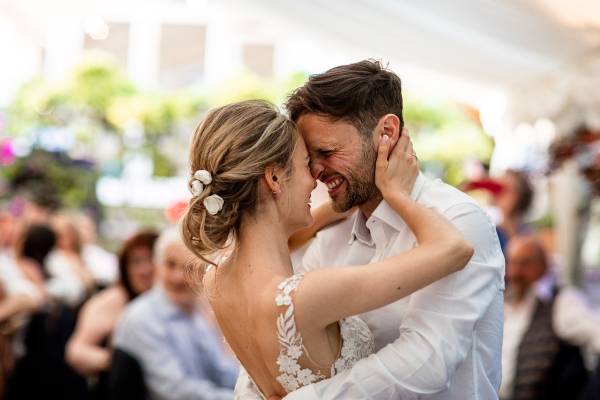 Bride and groom happily dancing