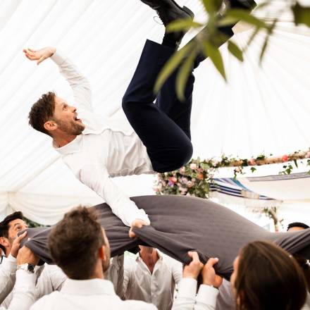 Groom thrown up high as per Jewish tradition
