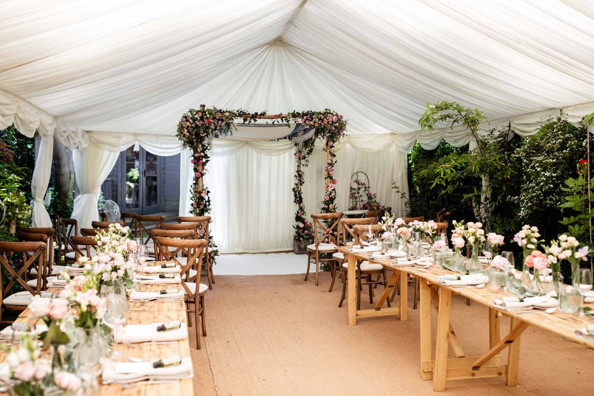 Pretty small marquee for a Jewish wedding ceremony, dinner and dancing in the garden