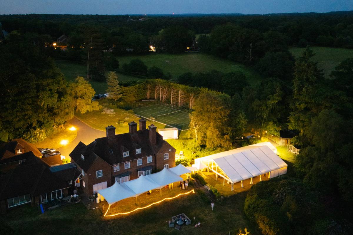Multiple marquee layout with a frame structure and three Chinese Hat tents