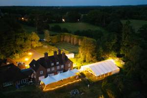 Multiple marquee layout with a frame structure and three Chinese Hat tents