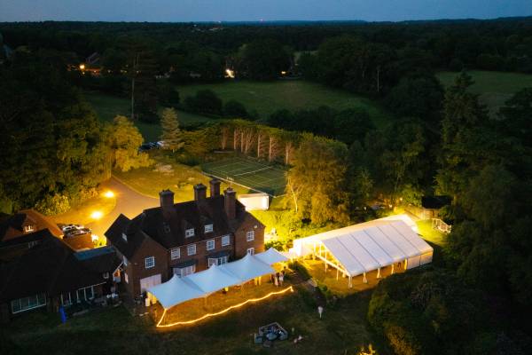 Multiple marquee layout with a frame structure and three Chinese Hat tents