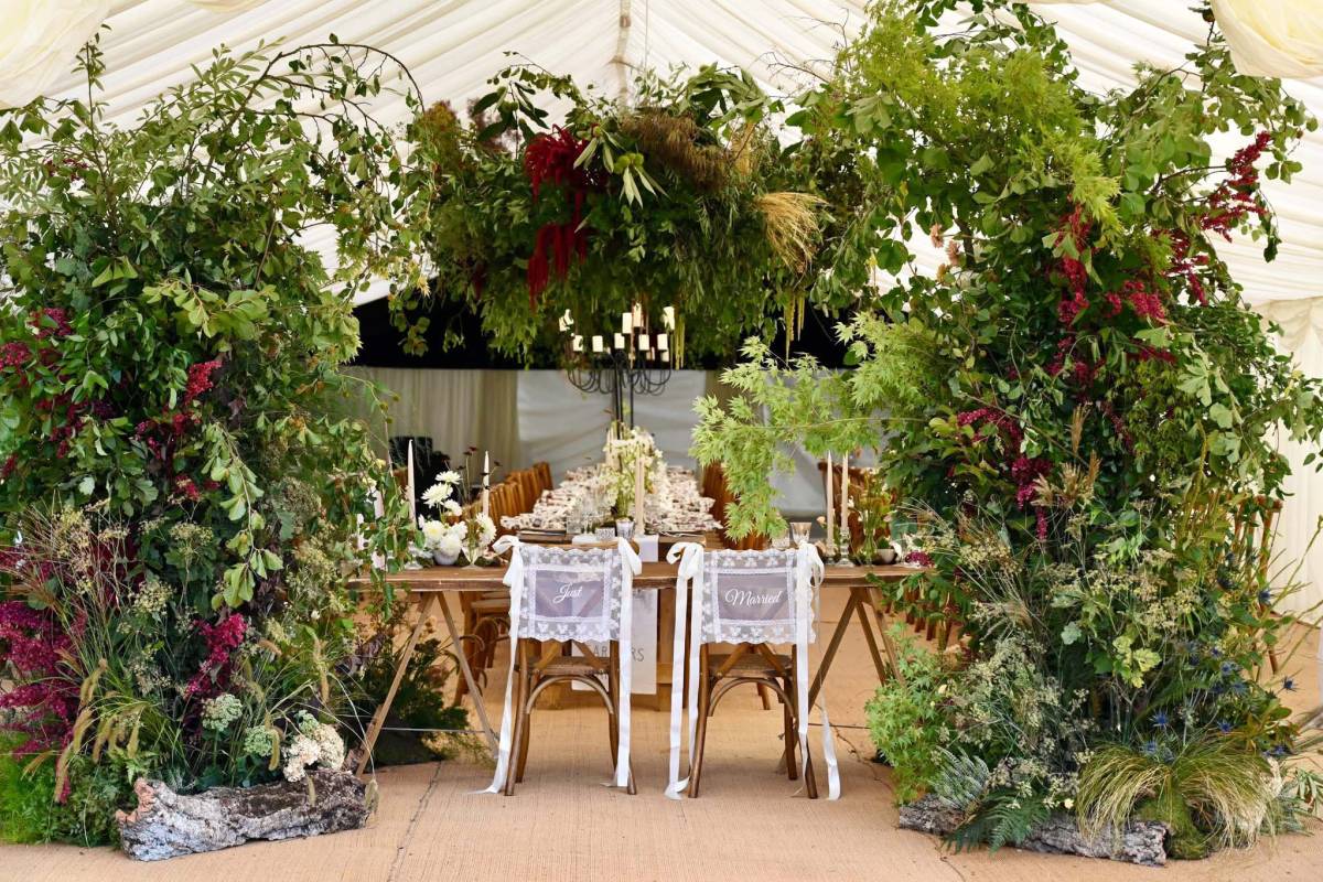 Magical floral design around Mr and Mrs chairs
